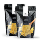 Two black pouches of The Spice Lab Country Style Honey Mustard Seasoning, each showcasing a wooden spoon filled with vibrant yellow seasoning powder on the front, deliver irresistible Country Style BBQ Flavor from The Spice Lab to your kitchen.