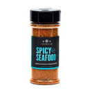 A clear spice jar from The Spice Lab Best Seller Seasoning Set features a vibrant reddish seafood and shellfish seasoning labeled Spicy Seafood, topped with a black lid and adorned with a blue-accented label—an excellent choice to enhance any grilling spices or seasoning collection.