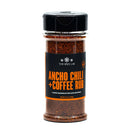 A clear spice jar labeled The Spice Lab Ancho Chili + Coffee Rub, crafted by The Spice Lab, designed for seasoning beef, pork, and chicken. This reddish-brown BBQ rub adds bold flavor to your favorite dishes and is perfect for bulk foodservice seasoning needs.