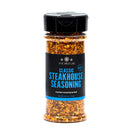 A clear spice bottle labeled The Spice Lab Classic Steakhouse Steak Seasoning, filled with a coarse blend of steak seasoning and BBQ herbs. Net weight: 6.2 oz (175g).