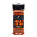 A clear spice jar labeled The Spice Lab Sweet Rib Rub, filled with a reddish seasoning blend. The label indicates it is a Low Sodium BBQ Rub, ideal for beef, pork, and chicken—making it a perfect addition to your bulk BBQ spices collection.