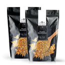 Two black resealable bags of The Spice Lab Fajita Seasoning, each displaying a wooden spoon and a burst of colorful Tex-Mex seasoning blend on the front.