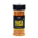 A clear spice jar of The Spice Lab Fajita Seasoning features a bold red and orange Tex-Mex blend inside, topped with a black cap and stylish black label—ideal for bringing vibrant flavor to chicken fajitas.