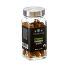 A clear glass jar of The Spice Lab Organic Cinnamon Sticks, featuring a silver lid and black label, displays the rich brown cinnamon sticks inside. This 1 oz (28g) jar is perfect for adding warm, aromatic flavor to mulled wine or chai.