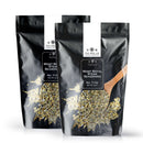 Two pouches of The Spice Lab Mont Royal Steak Seasoning, each featuring a wooden spoon and visible seasoning, are showcased against a white backdrop—ideal for anyone craving authentic Montreal-style flavor from The Spice Lab in every bite.