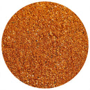 Close-up view of The Spice Lab Mexican Street Corn Seasoning by The Spice Lab—a vibrant orange-red spice blend with visible flecks of herbs and coarse salt—arranged in a circular shape on a white background.