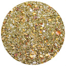 A close-up view of The Spice Lab Guacamole Seasoning—a vibrant dried herb and spice blend by The Spice Lab featuring green herbs, red pepper flakes, and coarse salt—displayed within a circular frame on a white background, perfect for keto-friendly guacamole.