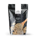 A black resealable pouch labeled The Spice Lab Smoked Butcher’s Blend, showing an image of a wooden spoon heaped with the umami seasoning spilling out. This blend features robust wood-smoked sea salt from The Spice Lab for rich, savory flavor.