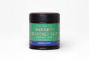 A 2.33 oz (66g) jar of World Spice Svaneti Seasoned Salt features a green and blue label with “Handcrafted Blend” and “World Spice” displayed. This Georgian seasoning salt from World Spice offers umami, earthy, and salty notes, highlighting traditional spices such as fenugreek and caraway on the label.