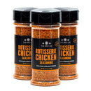 Three bottles of The Spice Lab Rotisserie Chicken Seasoning stand upright, each with an orange label and black cap, containing a reddish blend that imparts a classic roasted chicken flavor and adds a hint of golden color.
