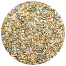 A close-up of a circular pile of dried mixed herbs and spices, featuring green and yellowish bits, highlights the savory onion flavor of The Spice Lab Three Onion Blend seasoning against a white background.