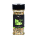 A clear plastic spice jar labeled The Spice Lab Three Onion Blend, from The Spice Lab, featuring a black and green label and filled with a dried seasoning mix that delivers savory onion flavor—ideal for enhancing recipes or creating a classic onion dip.