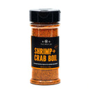 A bottle of The Spice Lab Shrimp + Crab Boil Seasoning, featuring a flavorful blend of spices for seafood and shellfish with a medium heat profile. The clear bottle comes with a black lid and a black label.