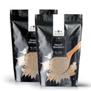 Two black pouches of The Spice Lab Night Market Seasoning by The Spice Lab, each showcasing their signature Asian salt and pepper blend and featuring a wooden spoon filled with spices on the front label, are displayed side by side against a white background.