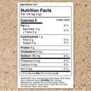 A Nutrition Facts label displayed on a sandy background details the ingredients and nutritional values for The Spice Lab Night Market Seasoning by The Spice Lab, an Asian salt and pepper blend, highlighting zero calories, fat, or protein, and 180 mg of sodium per 1/4 teaspoon serving.