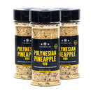 Three 5.3 oz bottles of The Spice Lab Polynesian Pineapple Rub, featuring black lids and black-yellow labels, are placed side by side against a white background. This tropical seasoning from The Spice Lab is perfect for infusing your favorite dishes with sweet and savory BBQ flavor.
