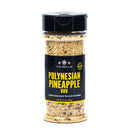 A clear spice jar from The Spice Lab labeled “Polynesian Pineapple Rub,” featuring a coarse tropical seasoning blend. The label showcases this sweet and savory BBQ rub as perfect for fish, pork, and chicken.