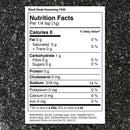 Nutrition label for The Spice Lab Black Steak Seasoning by The Spice Lab displayed on a black textured surface. It shows 0 calories per 1g serving, 0g fat, 1g carbs, and 318mg sodium. Ingredients include sea salt, sugar, and activated charcoal—adding that signature savory steakhouse flavor to every sprinkle.