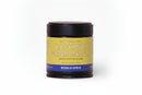A jar of World Spice Kashmiri Garam Masala from World Spice, distinguished by its yellow and blue label, is displayed against a plain white background. This handcrafted blend combines aromatic spices to deliver an authentic roasted masala flavor.