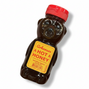 DDR BBQ Supply Guenther Apiary Arkansas hot honey in a classic bear-shaped squeeze bottle with a red cap.