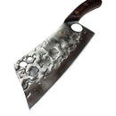 A close-up of the Spaceman Knives Meteor Series Kitchen Cleaver, featuring a textured blade with circular holes and a wooden handle, resting on white marble—a precise tool for chopping meat by Spaceman Knives.
