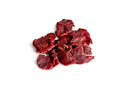 Several pieces of Blazing Star BBQ Reaper Burnt Ends Smoked Beef Jerky from Blazing Star BBQ, featuring a reddish-brown color, are arranged in a small pile on a plain white background.