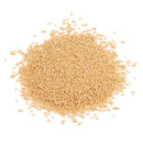 A pile of dry, beige-colored granules of The Spice Lab Granulated Brown Sugar, a baking essential from The Spice Lab brand, is scattered on a white surface. The appearance evokes its subtle grains and mild molasses flavor typical of granulated brown sugar.
