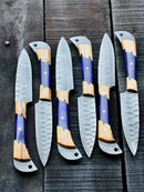 The Texan Knives Best Japanese Knife Set features a 13" forged stainless steel chef knife with an olivewood and blue epoxy resin handle, plus a leather sheath, beautifully displayed on a dark wooden surface.