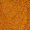 Close-up of a pile of The Spice Lab Organic Indian Curry Powder, displaying its fine, powdery texture and subtle orange-brown color variations—distinctive features of this aromatic seasoning from The Spice Lab.