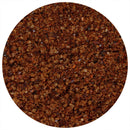 A close-up view of coarse dark brown granules, forming a circle filled with richly textured crystals on a white background—perfectly showcasing The Spice Lab Ancho Chili + Coffee Rub by The Spice Lab, an ideal bold BBQ seasoning for bulk foodservice needs.