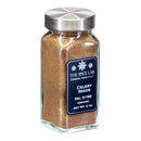 A clear glass jar with a metal lid contains The Spice Lab Ground Celery Seeds, perfect for pickling or enhancing your favorite grilling seasonings. The black label displays the brand name, product name, and Net Wt. 2 oz.