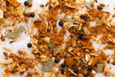 A close-up of various dried spices from World Spice Indonesian Ayam by World Spice—featuring black peppercorns, bay leaves, coriander seeds, dried onion flakes, and ground paprika—perfect for creating an aromatic spice blend inspired by authentic Indonesian Ayam Goreng.