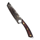 The Spaceman Knives Meteor Series Chef Knife by Spaceman Knives features an 8.5-inch hammered stainless steel blade and a wooden handle with brass rivets, resting on a marble countertop next to a black cloth and its knife box.