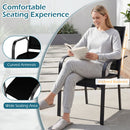 A woman in gray loungewear reads a book on a curved chair from the DirectDeals 5 Pieces Patio Dining Set for 4 Outdoor Square Table and Stackable Chairs, blending relaxation with style.
