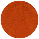 The Spice Lab Cayenne Pepper X-Hot Ground by The Spice Lab—a finely ground red-orange spice powder, captured from above in a circular shape on a white background—delivers a vibrant and intense burst of extra-hot seasoning to any dish.