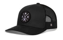 The Haka Hat Alaska Trucker Hat | Black AK X Snapback features a solid front with a star, A and K letters, and bear patch, plus breathable black mesh sides and back for comfort.