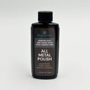 The Messermeister All Metal Polish - 1.7 oz is a black bottle with a black cap, labeled to remove rust and stains from high carbon steel. This effective stainless steel cleaner polishes and safely restores metal surfaces.