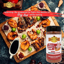 A BBQ feast with grilled meats, grapes, and cranberries on a rustic table features Hickman's BBQ Premium All Purpose Gluten Free Keto Friendly BBQ Rub 11 oz. Warning: You’ll need willpower to resist pigging out!.