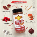 A labeled image of Hickman's BBQ Premium All Purpose Gluten Free Keto Friendly BBQ Rub 11 oz, with chili pepper, jalapeño, garlic, salt, smoked paprika, and onion displayed on a light wooden background.