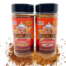 Two Blazing Star BBQ Sugar Free Bundle bottles from Blazing Star BBQ are displayed, labeled "All In One" and "Beef," surrounded by scattered seasoning. Each label showcases a smiling chef mascot and bold orange star designs. These blends are ideal for anyone looking for gluten free or sugar free BBQ seasonings to elevate their grill game.