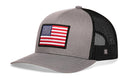 The Haka Hat American Flag Trucker Hat in gray-black features a USA flag patch, breathable black mesh back, and an H logo label, making this stylish snapback by Haka Hat perfect for everyday wear.