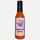 A 5 fl oz (148 ml) bottle of Culture Hot Sauce American Dream from Culture Hot Sauce, featuring a label with a blue handprint and an American flag background. This bold sauce combines cayenne chili peppers with Ranch seasoning for a flavorful taste of American heat.
