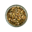Overhead view of a glass jar filled with SALTOPIA Infused Sea Salts’ Saltopia Italian Herbs Flavor Low Sodium: AMORE—a colorful blend of dried herbs and vegetables, perfect for healthy, low sodium cooking—set against a white background.
