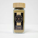 A 53g glass jar of Spice Wheel Anise Seed Powder, topped with a bamboo lid. The black label displays the Spice Wheel brand logo and detailed product information. Crafted from premium anise seeds, this aromatic powder delivers earthy undertones and a gentle licorice flavor, ideal for enhancing both sweet and savory recipes.