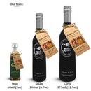 Three bottles of Georgetown Olive Oil Co. Apple Cider White Balsamic Vinegar, available in mini (60ml), small (200ml), and large (375ml) sizes, each featuring a brown tag. "Our Sizes" is written above, with the sizes listed below: Mini 60ml, Small 200ml, Large 375ml. Each bottle displays a black label and gold cap—crafted in the authentic tradition of Modena, Italy by Georgetown Olive Oil Co.