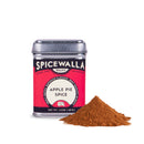 A tin of Spicewalla Apple Pie Spice by Spicewalla is displayed beside a small pile of brown spice powder on a white background, embodying the ideal Seasonal Spice Blend to elevate your fall baking creations.