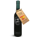 A dark bottle of Georgetown Olive Oil Co. Green Arbequina (SPAIN) Extra Virgin Olive Oil with a green cap, labeled "Georgetown Olive Oil Co.," featuring a tag displaying a map of Spain and information about Spanish olive oil and polyphenols.