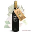 A bottle of Georgetown Olive Oil Co. ARTICHOKE & GARLIC Infused | High Polyphenols Extra Virgin Olive Oil, featuring a tan tag and black and white label, is displayed in front of artichoke and garlic illustrations. "SIGNATURE FLAVORS" appears at the bottom right.