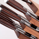 A close-up of the Messermeister Avanta Pakkawood Knife Block Set (10 Piece) by Messermeister, featuring stainless steel knives with Pakkawood handles neatly arranged in a stylish wooden block.
