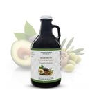 A bottle of Georgetown Olive Oil Co 50% Avocado Olive Oil + 50% Extra Virgin | High Polyphenols is placed in front of an avocado, olive leaves, and green olives. The label highlights its high polyphenol content and cold-pressed blend—perfect for cooking, grilling, sautéing, vinaigrettes, and marinades.